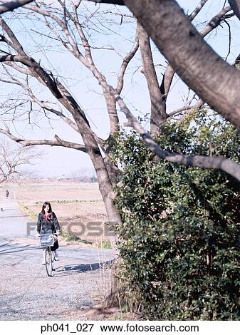 School girl cycling View Large Photo Image Stock Photo - School girl cycling. Fotosearch