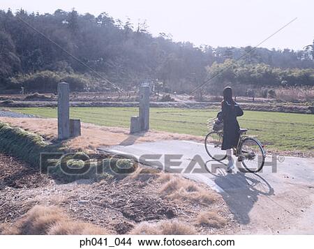 School School girl cycling View Large Photo Image Picture - School School girl cycling. Fotosearch