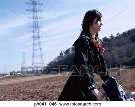 School School girl cycling View Large Photo Image Stock Photograph - School School girl cycling. Fotosearch