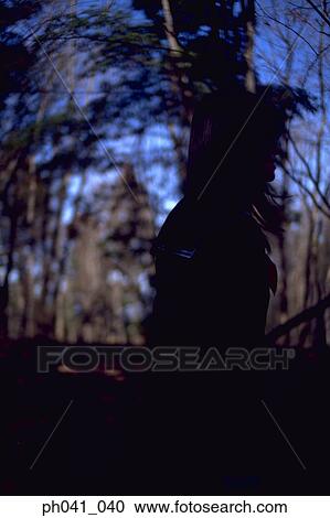 Stock Image - Woman in a park. Fotosearch