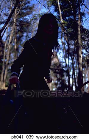 Woman playing in the park View Large Photo Image Stock Photo - Woman playing in the park. Fotosearch