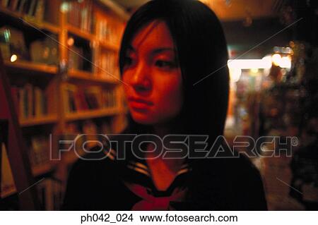 Picture - School girl at a shop. Fotosearch