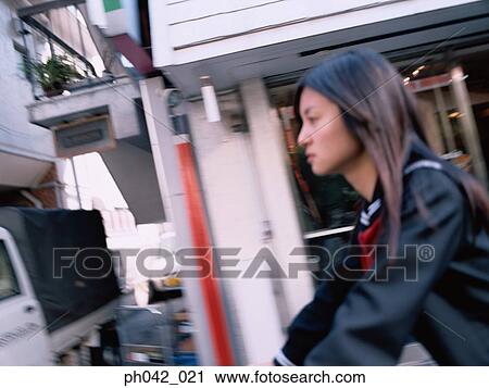 School girl cycling View Large Photo Image Stock Image - School girl cycling. Fotosearch