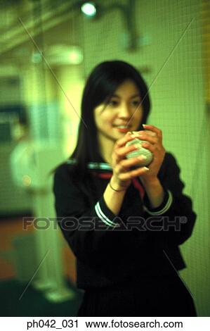 School girl holding a baseball View Large Photo Image Stock Image - School girl holding a baseball. Fotosearch