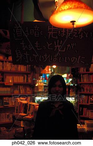 School girl in a book shop View Large Photo Image Stock Photograph - School girl in a book shop. Fotosearch