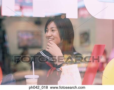 School girl in a café View Large Photo Image Stock Photo - School girl in a café. Fotosearch