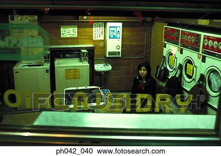 School girl in a laundry shop View Large Photo Image Stock Image - School girl in a laundry shop. Fotosearch