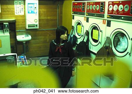 School girl in a laundry shop View Large Photo Image Stock Image - School girl in a laundry shop. Fotosearch