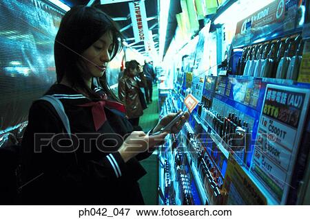Stock Photo - School girl making a call. Fotosearch