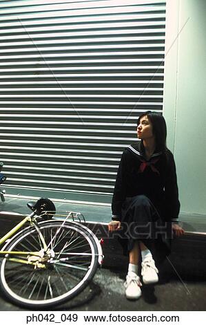 Stock Photo - School girl sitting. Fotosearch