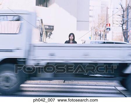 School girl waiting to cross the road View Large Photo Image Stock Photo - School girl waiting to cross the road. Fotosearch