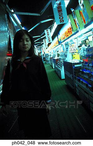 School girl walking along the street View Large Photo Image Stock Photo - School girl walking along the street. Fotosearch