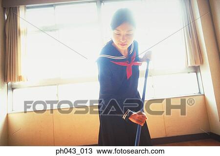 School girl cleaning the classroom View Large Photo Image Stock Image - School girl cleaning the classroom. Fotosearch