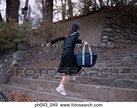 School girl climbing the steps View Large Photo Image Stock Photo - School girl climbing the steps. Fotosearch