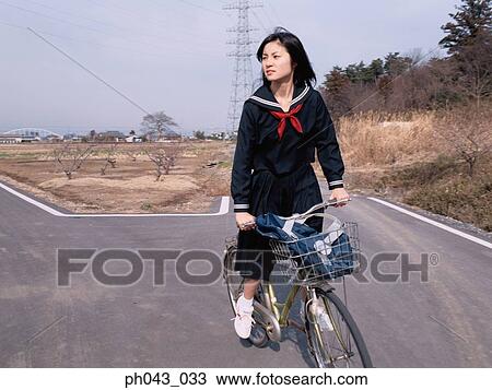 School girl cycling View Large Photo Image Stock Image - School girl cycling. Fotosearch