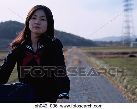 School girl cycling View Large Photo Image Stock Photograph - School girl cycling. Fotosearch