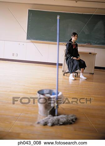 Stock Photo - School girl sitting in the classroom. Fotosearch