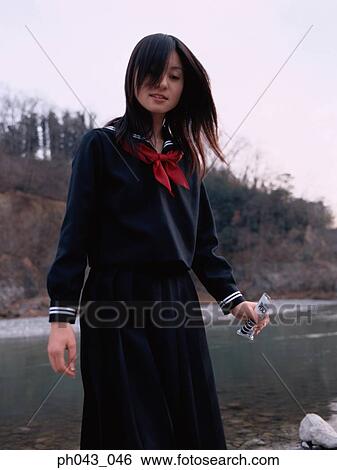 School girl standing along the river bed View Large Photo Image Stock Photograph - School girl standing along the river bed. Fotosearch