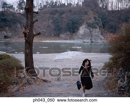 School girl walking up the steps View Large Photo Image Stock Image - School girl walking up the steps. Fotosearch