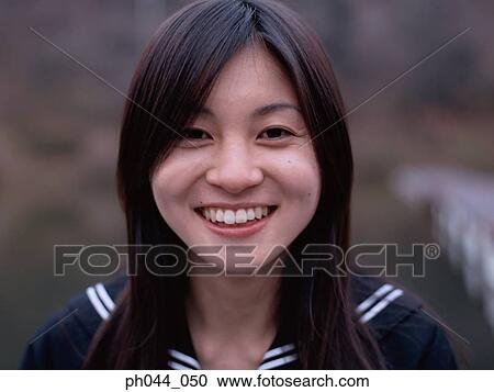 Portrait of a Asian woman in uniform View Large Photo Image Stock Image - Portrait of a Asian woman in uniform. Fotosearch