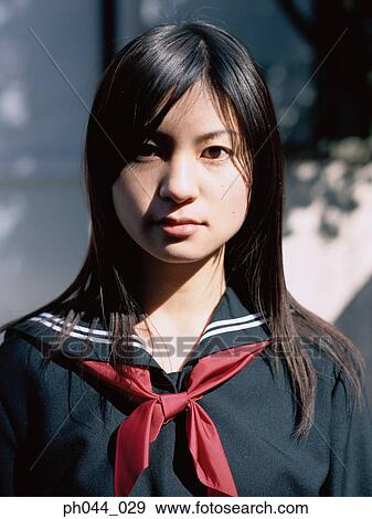 Portrait of a Asian woman in uniform View Large Photo Image Stock Photo - Portrait of a Asian woman in uniform. Fotosearch