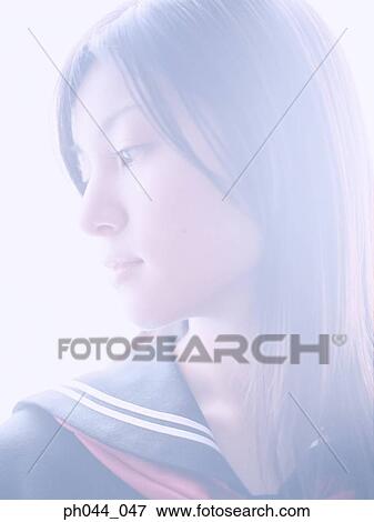 Stock Photo - Portrait of a Asian woman in uniform. Fotosearch