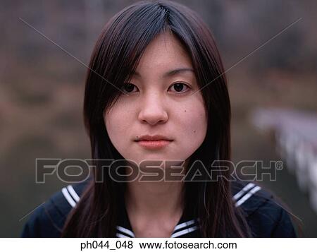 Portrait of a Asian woman in uniform View Large Photo Image Stock Photo - Portrait of a Asian woman in uniform. Fotosearch