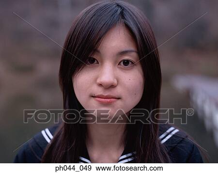 Portrait of a Asian woman in uniform View Large Photo Image Stock Photo - Portrait of a Asian woman in uniform. Fotosearch