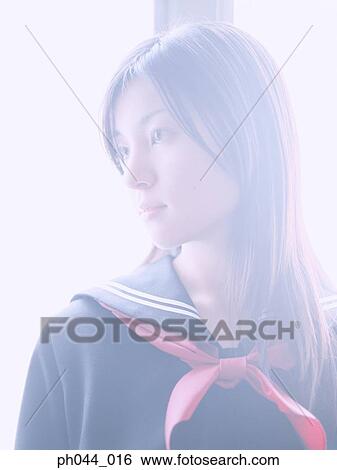Stock Photograph - Portrait of a Asian woman in uniform. Fotosearch
