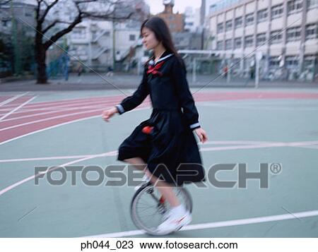 School girl cycling at the stadium View Large Photo Image Stock Image - School girl cycling at the stadium. Fotosearch