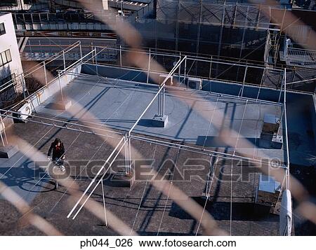 School girl cycling in the void deck View Large Photo Image Stock Photograph - School girl cycling in the void deck . Fotosearch