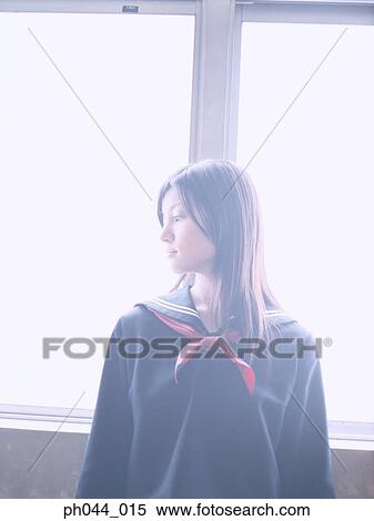 School girl leaning against a window View Large Photo Image Stock Photography - School girl leaning against a window. Fotosearch
