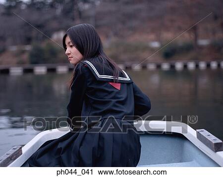 School girl sitting in a boat View Large Photo Image Stock Image - School girl sitting in a boat. Fotosearch