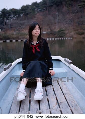 School girl sitting in a boat View Large Photo Image Stock Image - School girl sitting in a boat. Fotosearch