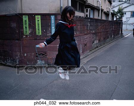 School girl skipping View Large Photo Image Stock Image - School girl skipping. Fotosearch