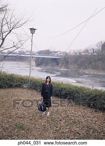 School girl standing in the park View Large Photo Image Stock Image - School girl standing in the park. Fotosearch