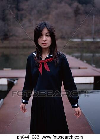 School girl standing on the pathway View Large Photo Image Stock Image - School girl standing on the pathway. Fotosearch