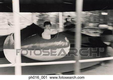 Boy on a amusement car ride View Large Photo Image Stock Image - Boy on a amusement car ride. Fotosearch