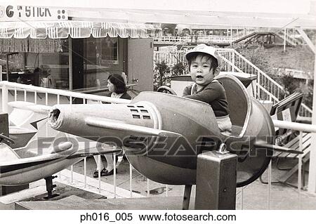 Boy on a spaceship ride View Large Photo Image Stock Photography - Boy on a spaceship ride. Fotosearch