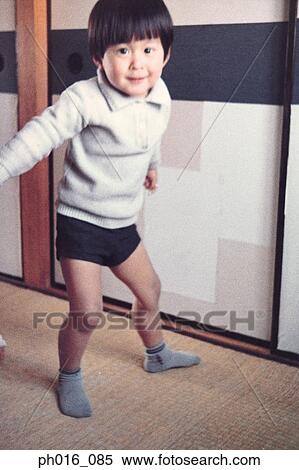 Boy playing at home View Large Photo Image Stock Photography - Boy playing at home. Fotosearch