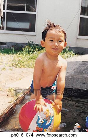 Boy playing in outdoor pool View Large Photo Image Picture - Boy playing in outdoor pool. Fotosearch
