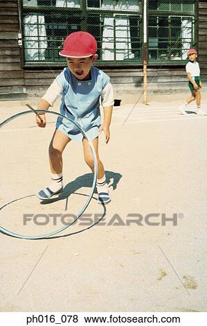 Stock Photo - Boy playing in the school yard. Fotosearch