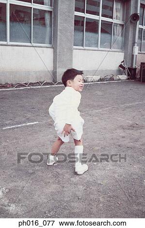 Boy posing in school yard View Large Photo Image Stock Photo - Boy posing in school yard. Fotosearch