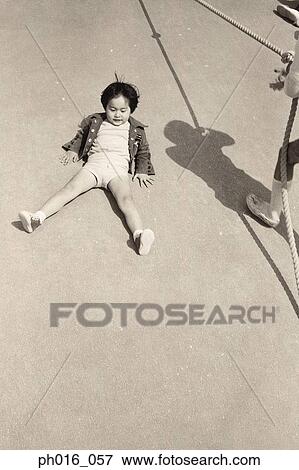 Boy sitting on the ground View Large Photo Image Stock Photo - Boy sitting on the ground. Fotosearch