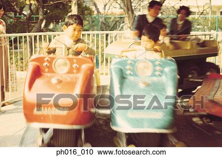 Children on a amusement car ride View Large Photo Image Stock Image - Children on a amusement car ride. Fotosearch