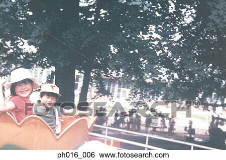 Children on a amusement cup ride View Large Photo Image Stock Photograph - Children on a amusement cup ride. Fotosearch