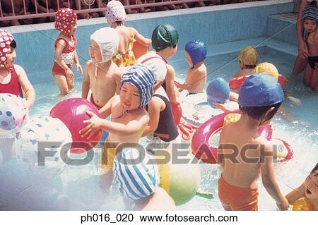 Children playing in a swimming pool View Large Photo Image Stock Image - Children playing in a swimming pool. Fotosearch
