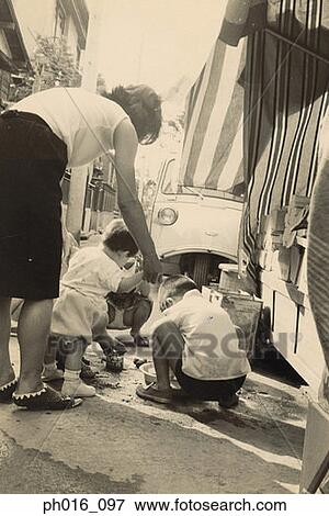 Stock Photo - Children washing a vehicle. Fotosearch