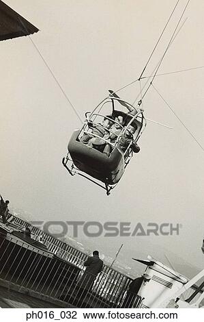 Father and children in a cable car View Large Photo Image Stock Image - Father and children in a cable car. Fotosearch