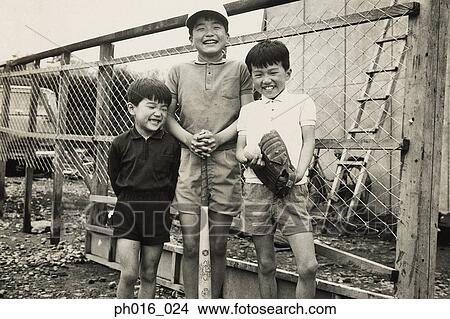 Picture - Portrait of three boys standing. Fotosearch